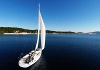 sailing yacht sailboat sail into sea bay croatia blue sky sailing yacht sails